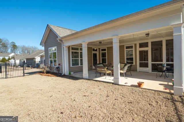 back of house with an outdoor hangout area and a patio