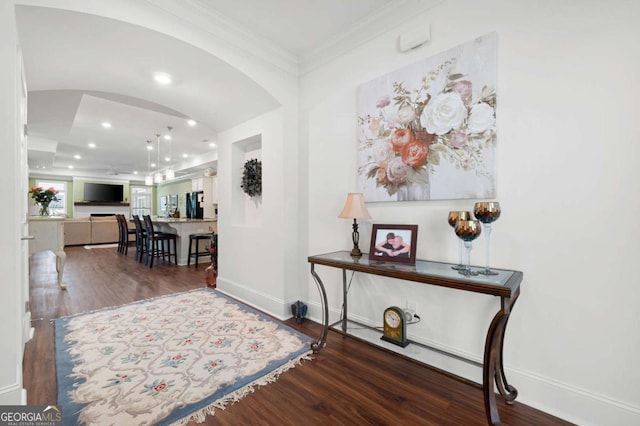 interior space featuring crown molding and hardwood / wood-style flooring