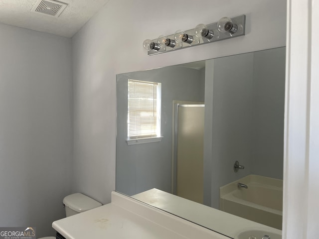 bathroom featuring visible vents, toilet, a bathing tub, vanity, and walk in shower