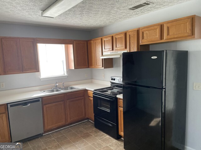 kitchen featuring sink, a textured ceiling, and black appliances