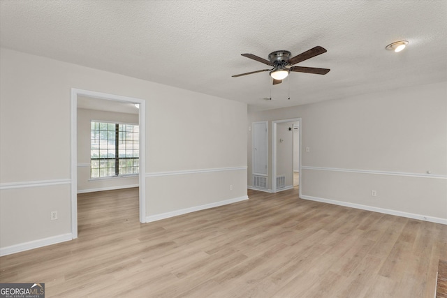 unfurnished room with a textured ceiling, ceiling fan, and light hardwood / wood-style floors