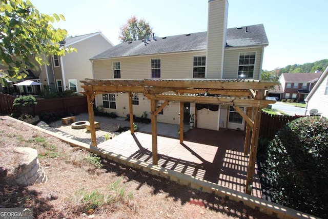 back of house with a pergola and a patio area