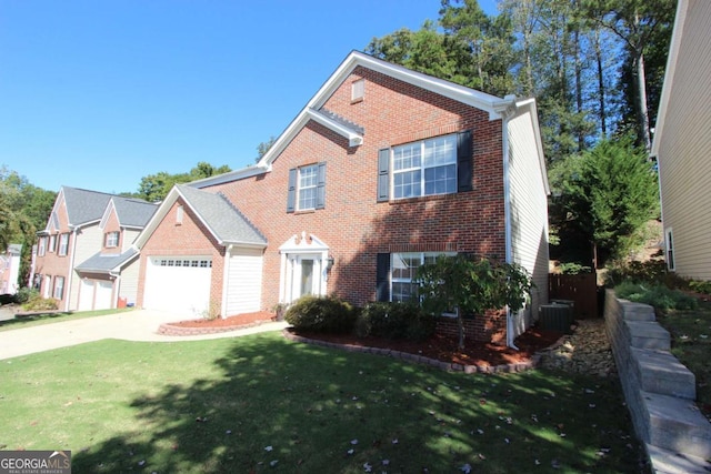 view of front facade with a front lawn, cooling unit, and a garage