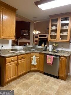 kitchen featuring a peninsula, glass insert cabinets, brown cabinets, and stainless steel dishwasher