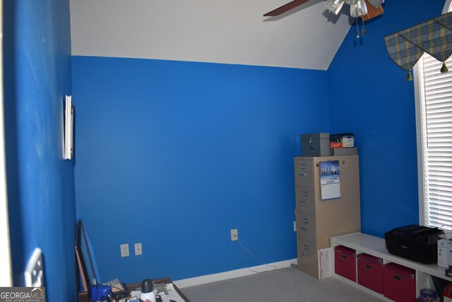 unfurnished bedroom with ceiling fan and vaulted ceiling