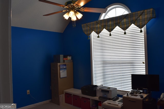 unfurnished office with lofted ceiling and ceiling fan