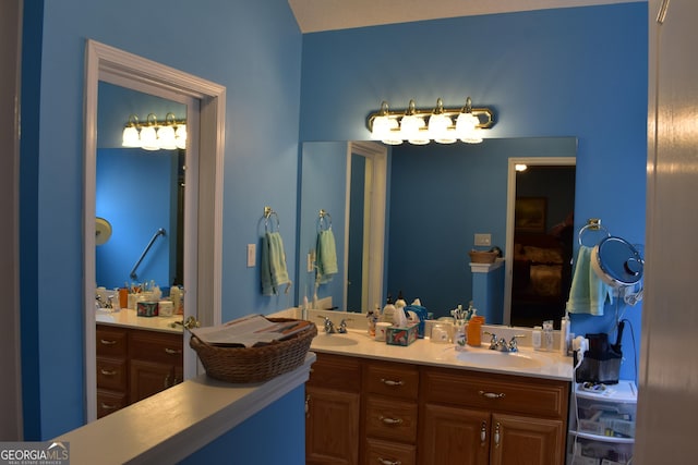 bathroom featuring double vanity and a sink