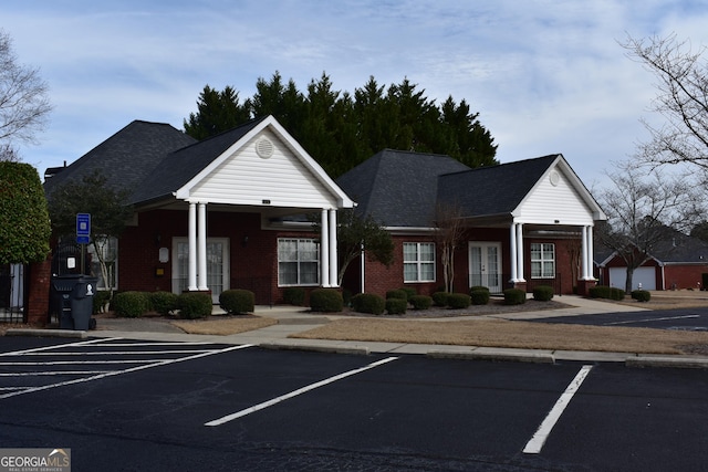 view of property with uncovered parking