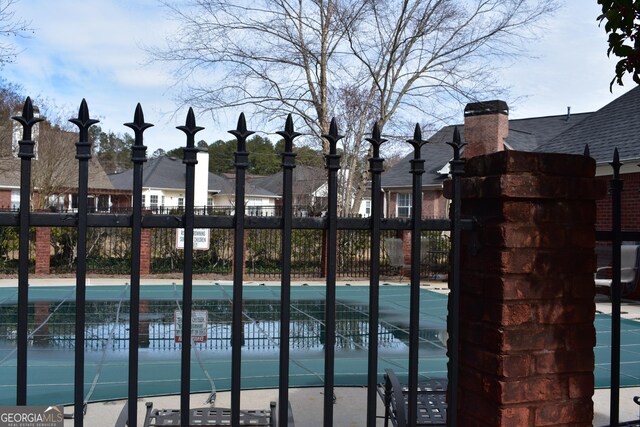 view of gate featuring fence