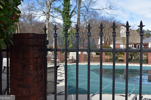 view of gate featuring fence