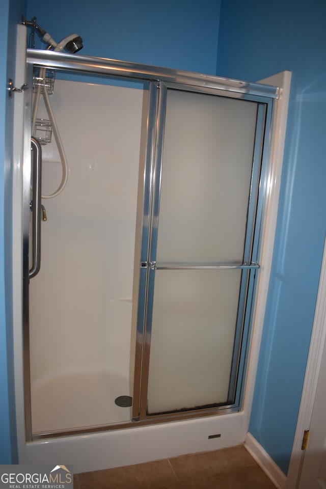 full bathroom with a shower stall