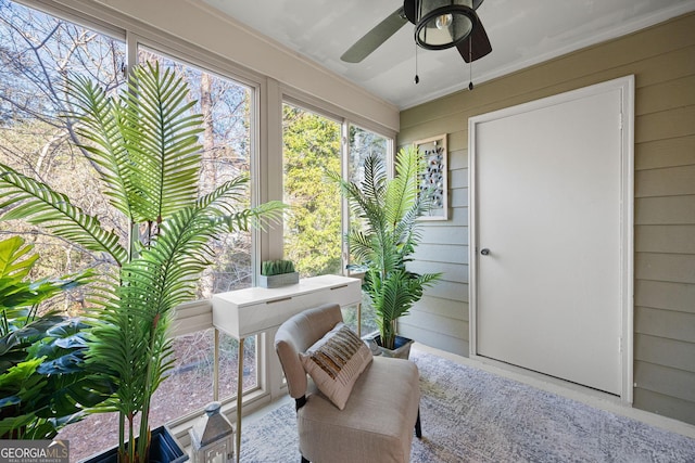 sunroom / solarium with ceiling fan