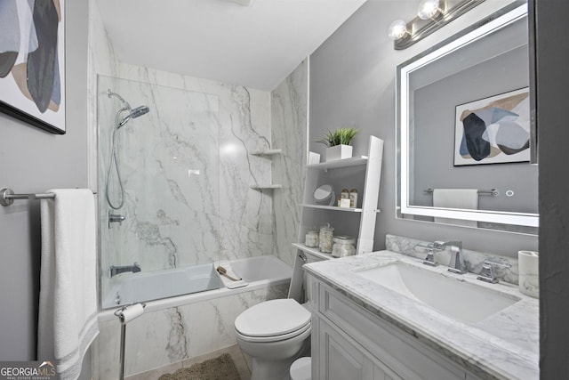 full bathroom featuring toilet, tiled shower / bath combo, and vanity