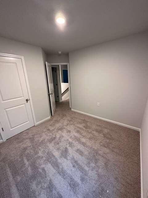 unfurnished bedroom featuring carpet flooring