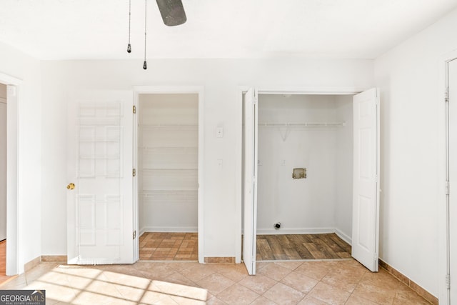 clothes washing area with washer hookup and light tile patterned floors