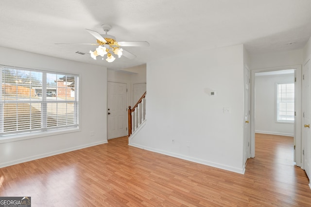 unfurnished room with ceiling fan and light hardwood / wood-style floors