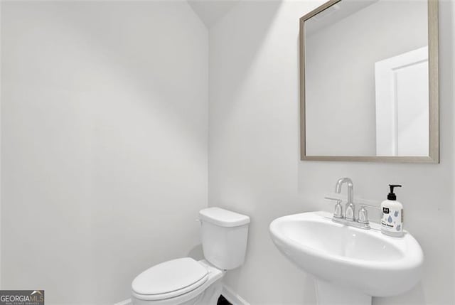 bathroom with toilet and sink