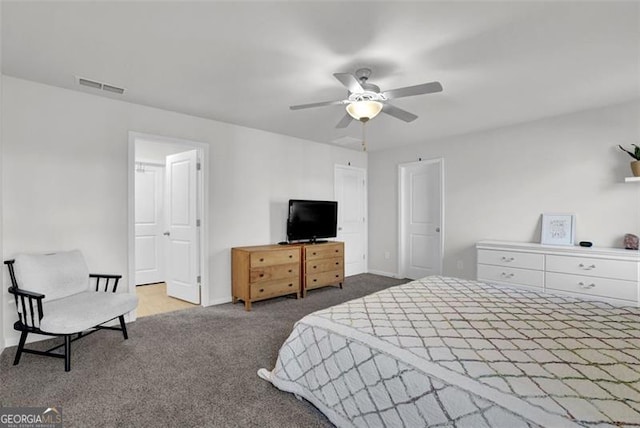 bedroom with ceiling fan and carpet