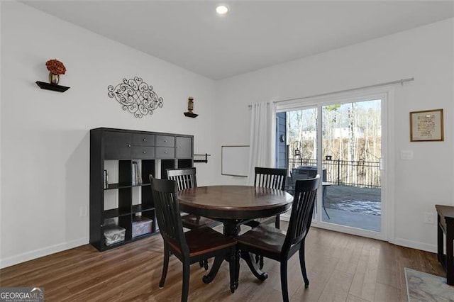 dining area featuring dark hardwood / wood-style flooring