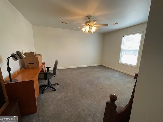 carpeted office featuring ceiling fan