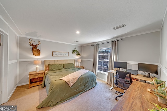 carpeted bedroom with crown molding and a textured ceiling