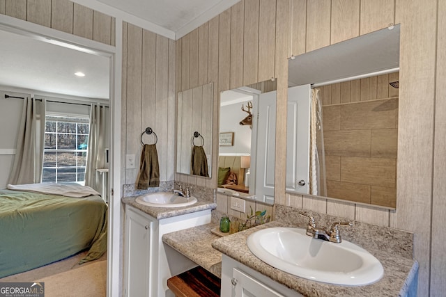 bathroom featuring wood walls and vanity