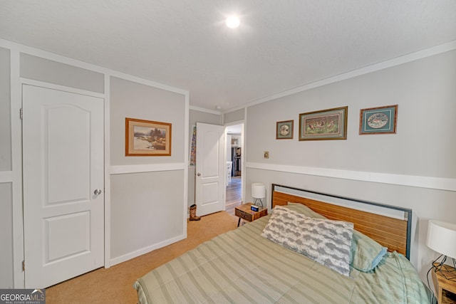 carpeted bedroom featuring crown molding