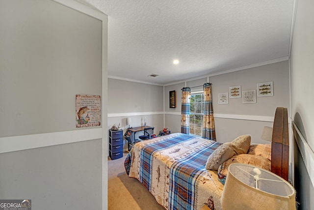 bedroom with a textured ceiling, ornamental molding, and light carpet