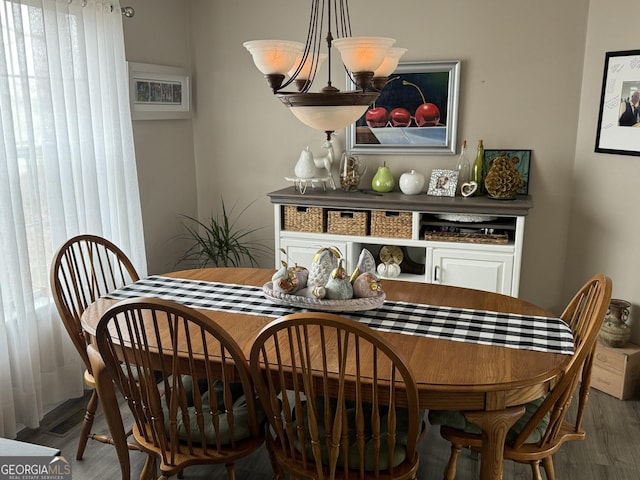 dining room with hardwood / wood-style flooring