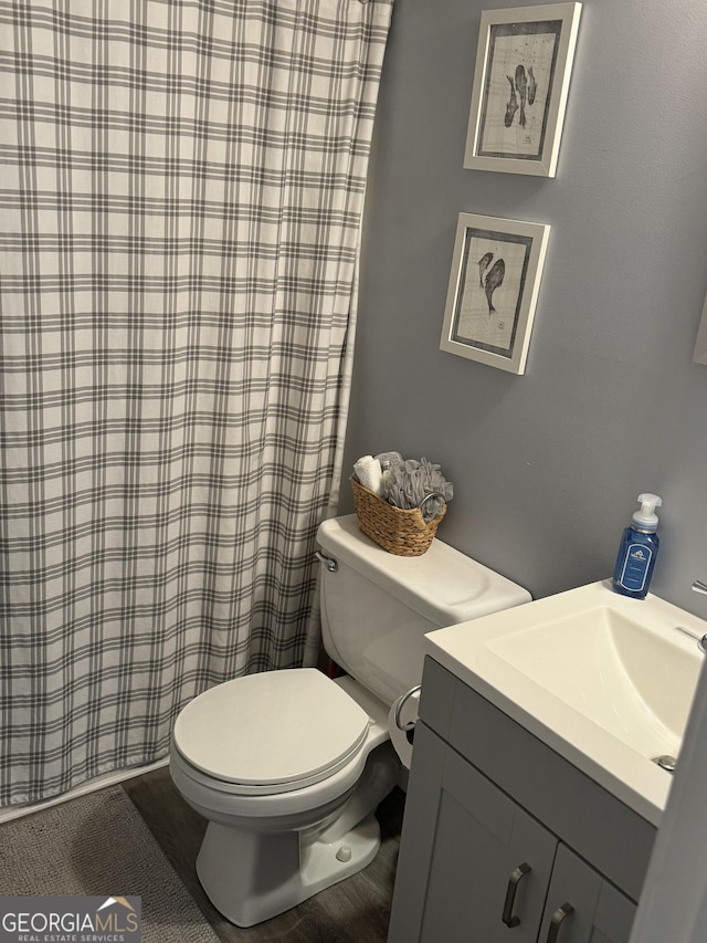 bathroom featuring toilet and vanity