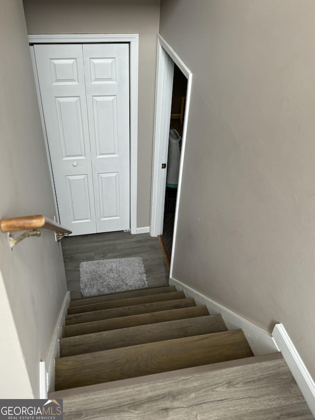 stairs with wood-type flooring