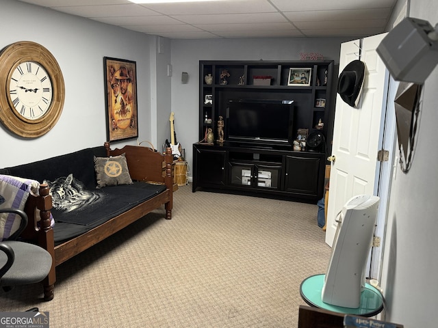 carpeted living room featuring a paneled ceiling