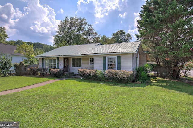 single story home with a front yard