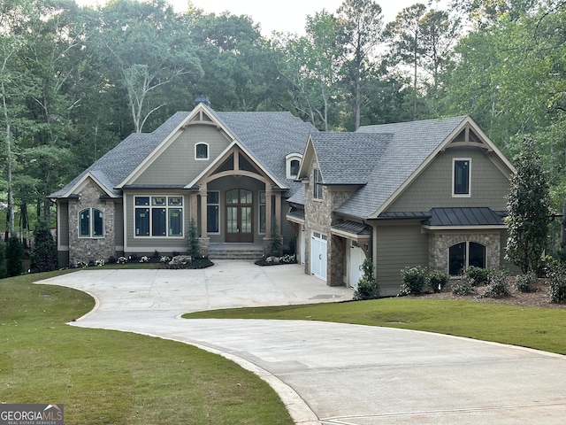 1140 Fox Bnd, Greensboro, GA 30642 - craftsman house with driveway, stone siding, a standing seam roof, and a front lawn