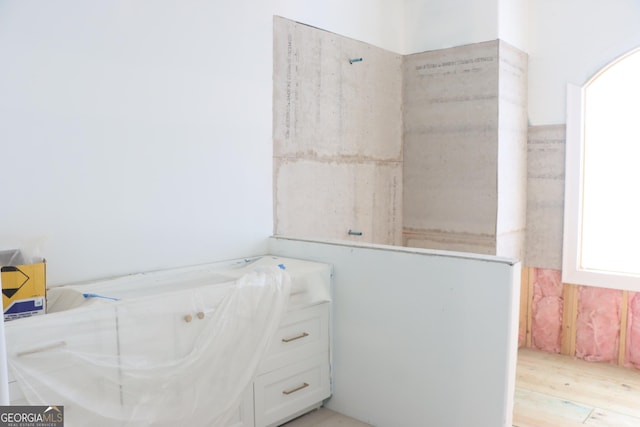 1140 Fox Bnd, Greensboro, GA 30642 - bathroom with wood finished floors and a tub with jets