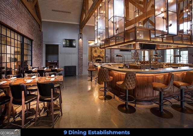1140 Fox Bnd, Greensboro, GA 30642 - bar area featuring a towering ceiling and beamed ceiling