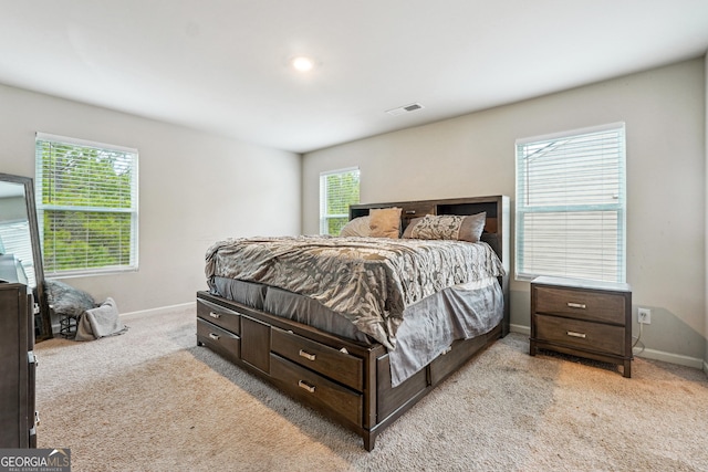 bedroom with light carpet