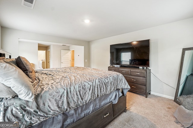 bedroom featuring light colored carpet