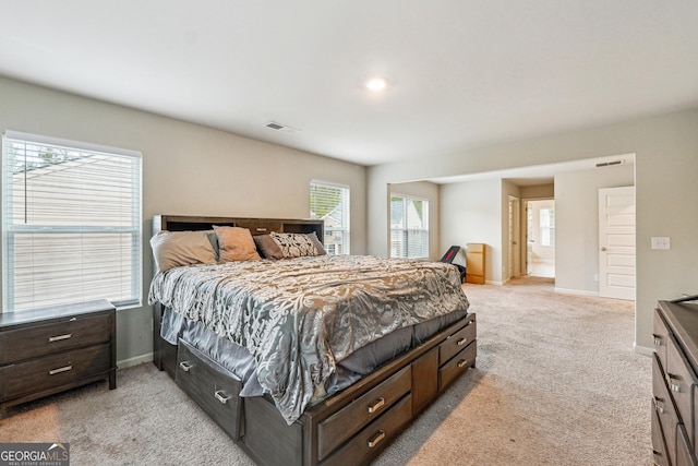 bedroom featuring light carpet