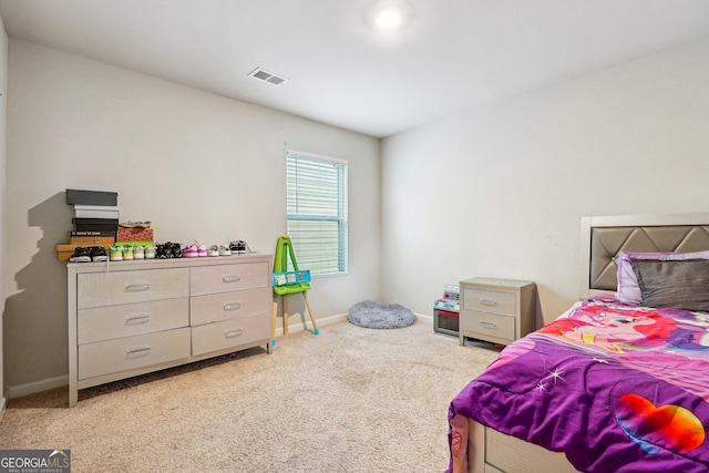 bedroom with light colored carpet