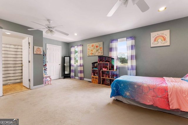 carpeted bedroom with a ceiling fan, recessed lighting, connected bathroom, and baseboards