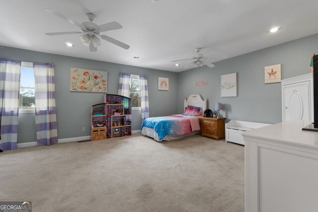 living room with ceiling fan, a brick fireplace, ornamental molding, and light wood-type flooring