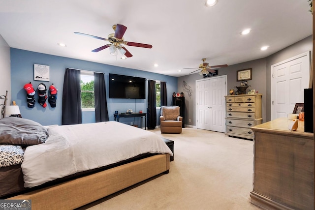 bedroom featuring multiple windows, recessed lighting, and light colored carpet