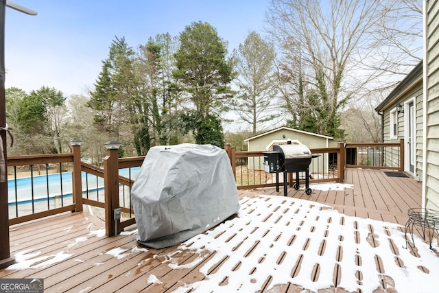 view of yard featuring a playground, a swimming pool side deck, and a fire pit