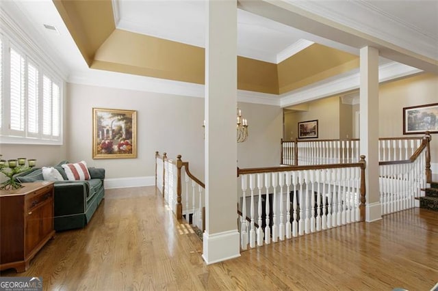 corridor featuring light hardwood / wood-style floors and ornamental molding