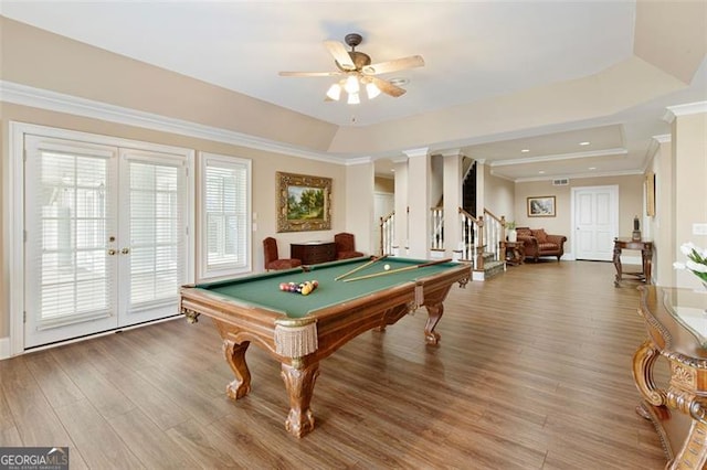 recreation room featuring a raised ceiling, billiards, ceiling fan, and wood-type flooring