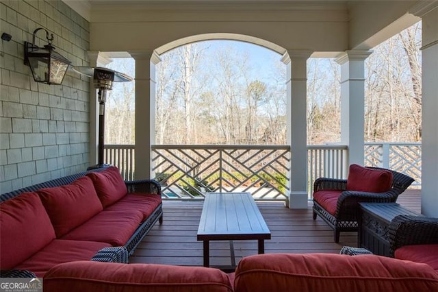 wooden deck featuring outdoor lounge area