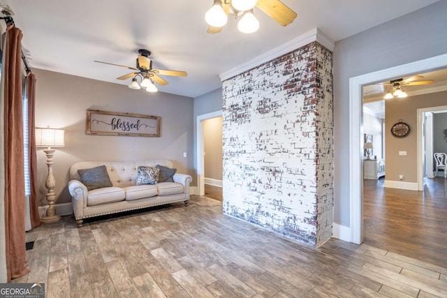 living room featuring ceiling fan and wood-type flooring