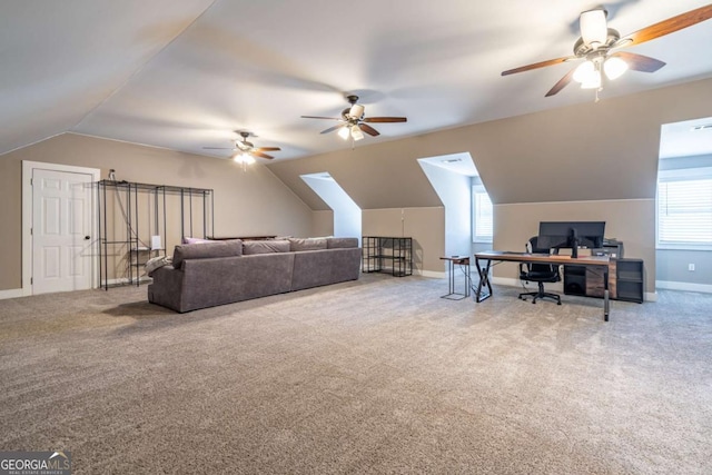 carpeted living room with ceiling fan and lofted ceiling