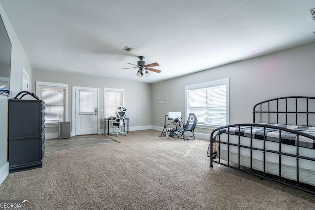 bedroom with ceiling fan and carpet flooring